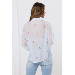 Bluzka kopertowa z motywem kwiatowym i koronkowym wykończeniem