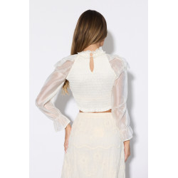 Krótka bluzka z falbankami i biżuteryjną kokardą