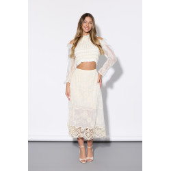 Krótka bluzka z falbankami i biżuteryjną kokardą