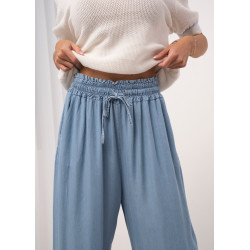 Luźne spodnie jeansowe z gumką i wiązaniem w pasie