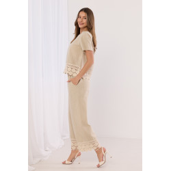 Szerokie spodnie z haftowanym dołem