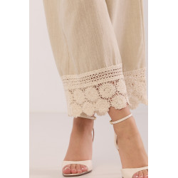 Szerokie spodnie z haftowanym dołem