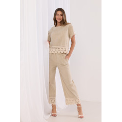 Szerokie spodnie z haftowanym dołem