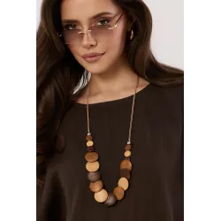 Bluzka o kroju oversize z ozdobnym naszyjnikiem