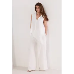 Komplet z asymetryczną bluzką z koronką i szerokimi spodniami