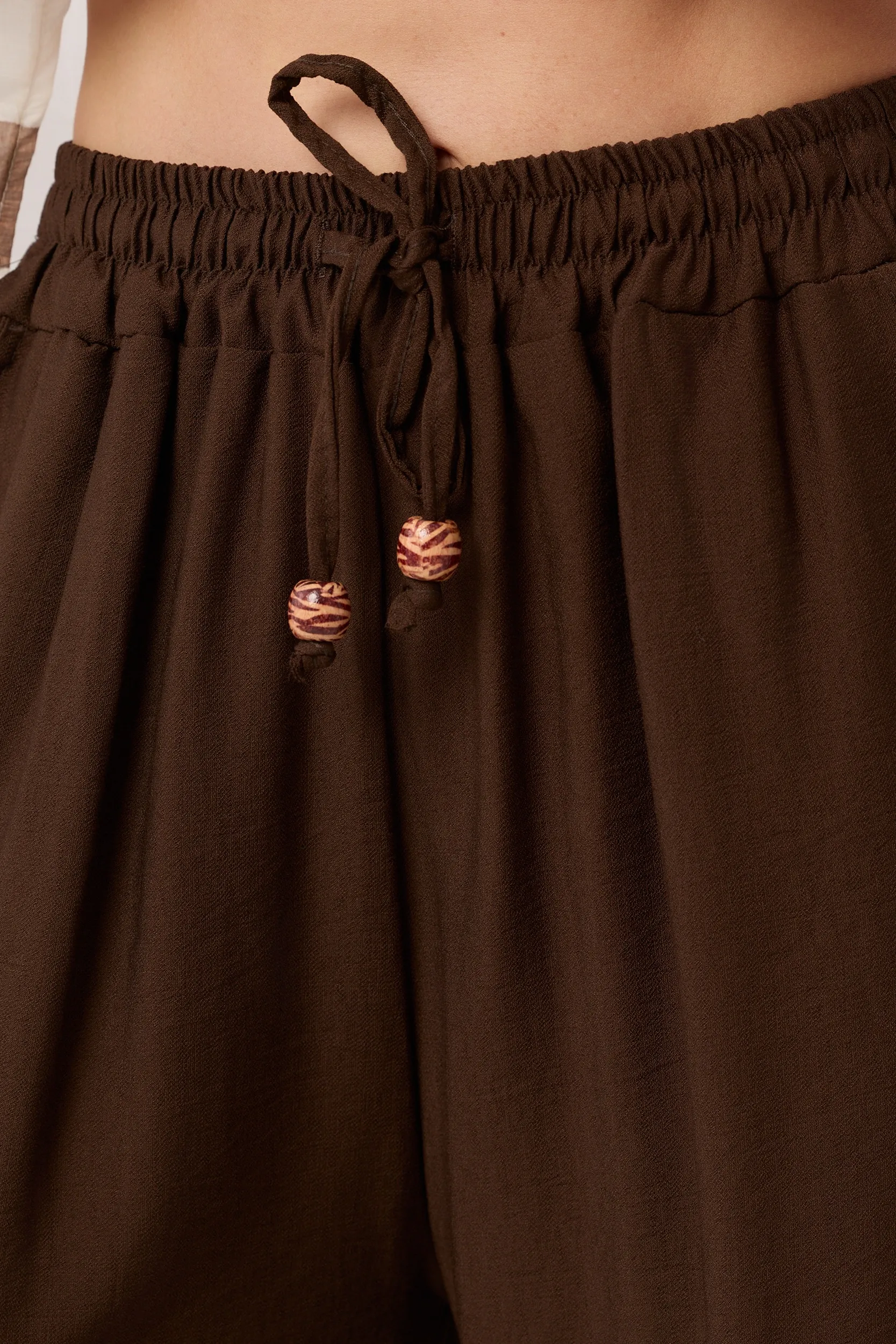 Spodnie typu palazzo z ozdobnym sznurkiem | Hurtownia odzieży damskiej online