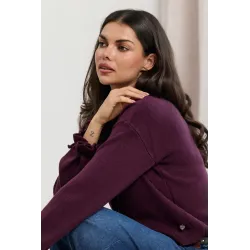 Dzianinowy sweter z kokardkami na rękawach