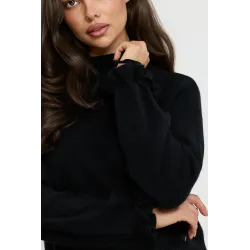 Dzianinowy sweter z kokardkami na rękawach
