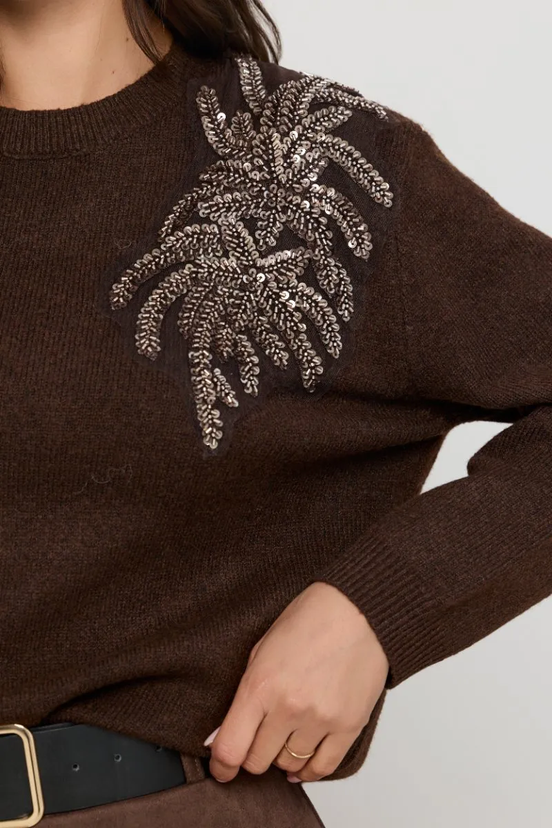 Sweter z aplikacją liści z cekinami