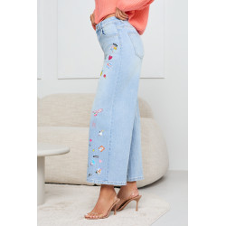 JEANSY O TYPU WIDE LEG Z WIELOMOTYWOWYM NADRUKIEM