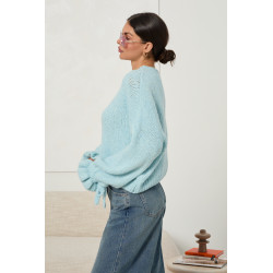 Oversizowy sweter z wiązaniami na rękawach