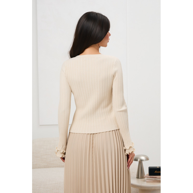 Bluzka z ozdobnymi złotymi guzikami i falbanką przy rękawie | Odzież damska w hurcie